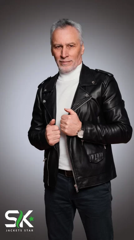 Front studio shot of our handcrafted men's black genuine leather biker jacket with shoulder epaulets, wide snap lapels, and asymmetrical zipper closure.