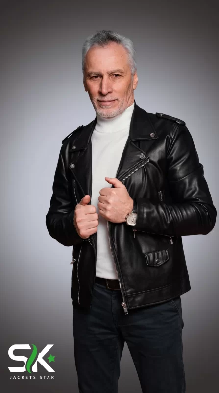 Front studio shot of our handcrafted men's black genuine leather biker jacket with shoulder epaulets, wide snap lapels, and asymmetrical zipper closure.