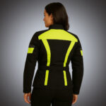 Rear view of a women's black technical motorcycle jacket featuring large neon yellow high-visibility panels on the shoulders and back, with an adjustable waist belt and reinforced safety stitching.