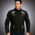 Front view of a men’s black technical motorcycle touring jacket featuring white reflective shoulder accents, multiple utility cargo pockets, and adjustable waist cinching for bulk OEM supply.