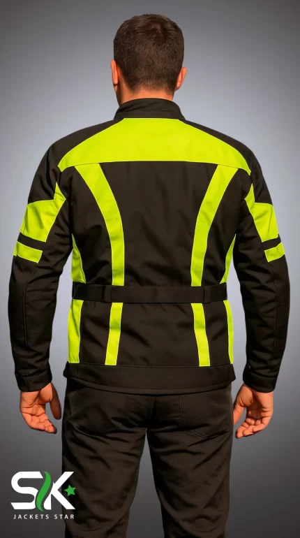 Studio back view of male rider wearing high-visibility yellow and black textile motorcycle jacket with waist cinch belt.