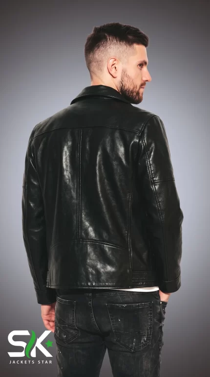 Back view studio shot of our handcrafted men's black genuine leather biker jacket showcasing structured shoulder yoke and clean vertical seams.