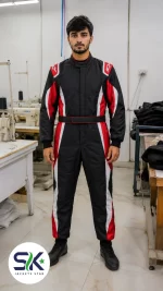 Male model standing in factory wearing black red and white high-abrasion Cordura go-kart suit made on demand in Sialkot.
