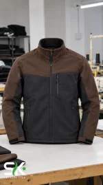 Front view of a men's brown and black softshell tactical jacket with vertical zip chest pocket, full zipper closure, and high stand collar, manufactured by Sialkot Jackets Star supplier.