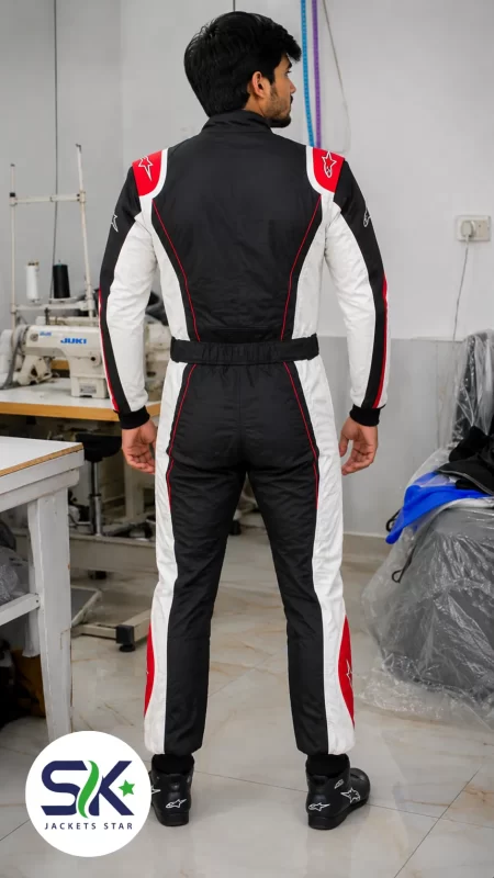 Rear view of model wearing black white and red Cordura go-kart racing suit inside Sialkot manufacturing factory.
